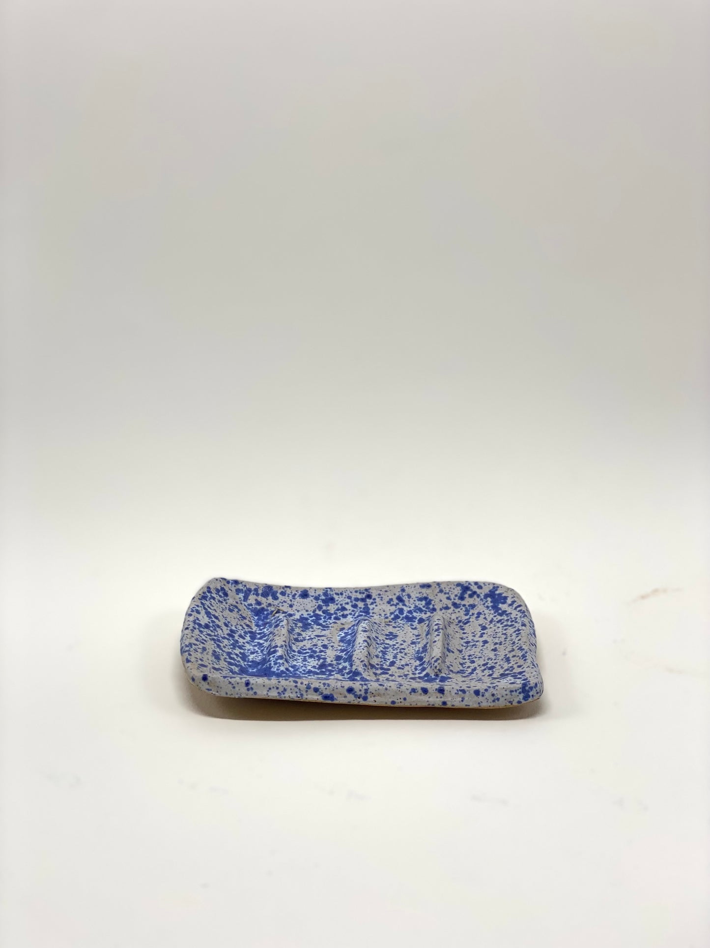 Blue speckled soap dish